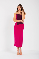 Fitted, strapless dress featuring fuchsia and plum colour blocking, asymmetrical (sloped) neckline, mid-length skirt. Fitted throughout with some stretch. Made in a woven stretch crepe fabric.