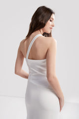 Modified version of Hartland Dress featuring asymmetrical (sloped) neckline, one-shoulder strap, side slits, mid-length hemline, fitted throughout. Custom made in a matte and satin woven stretch crepe fabric.